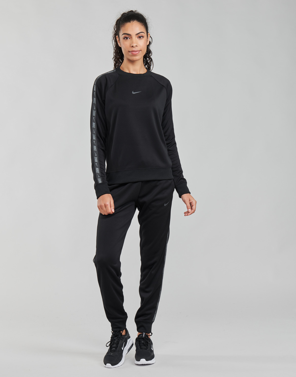 tekstylia Damskie Spodnie dresowe Nike W NSW PK TAPE REG PANT Czarny