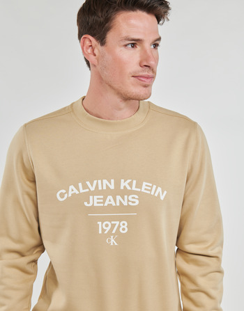 Calvin Klein Jeans VARSITY CURVE CREW NECK Beżowy